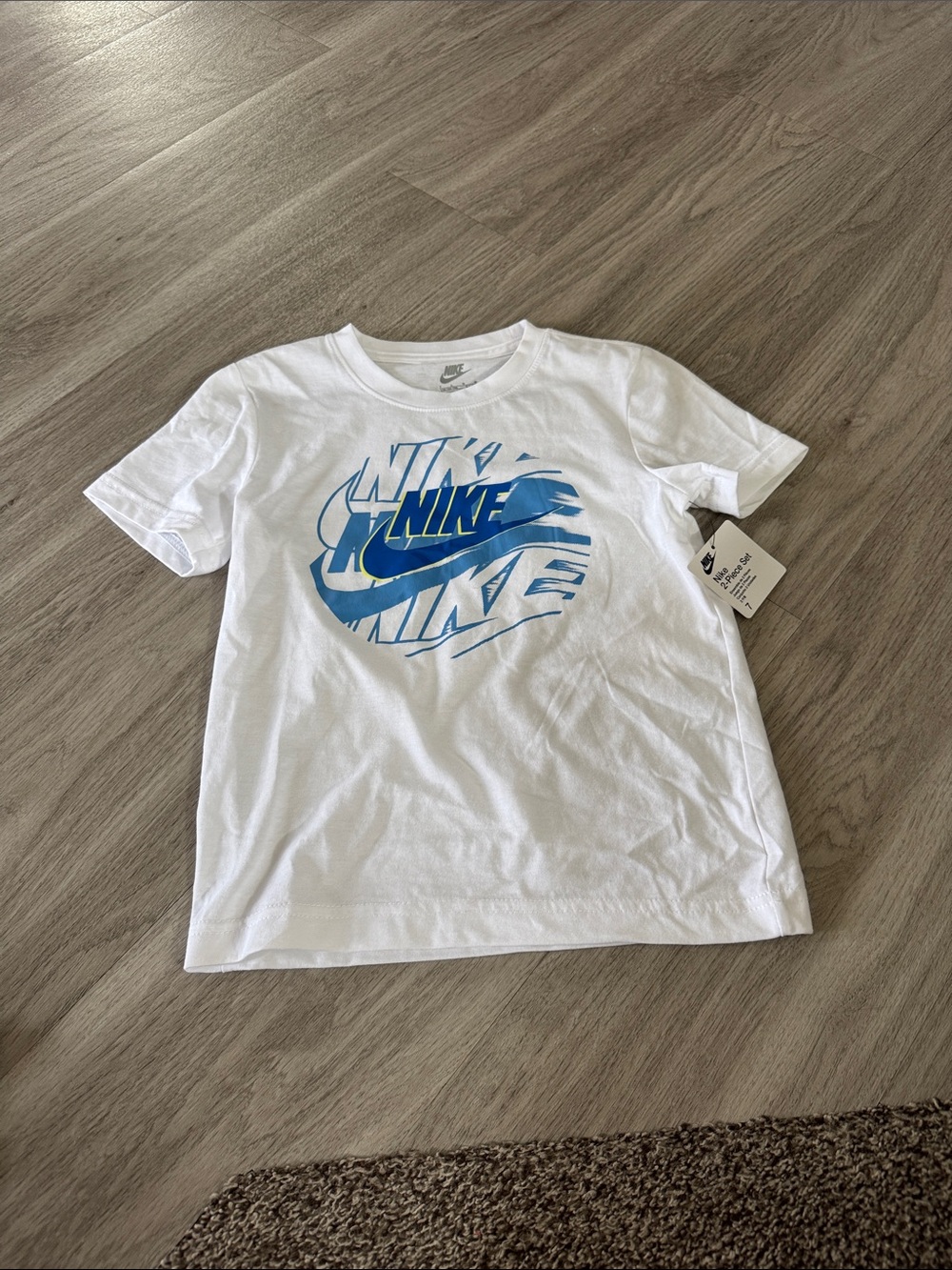 Nike White Tee with Blue Graphic Swoosh